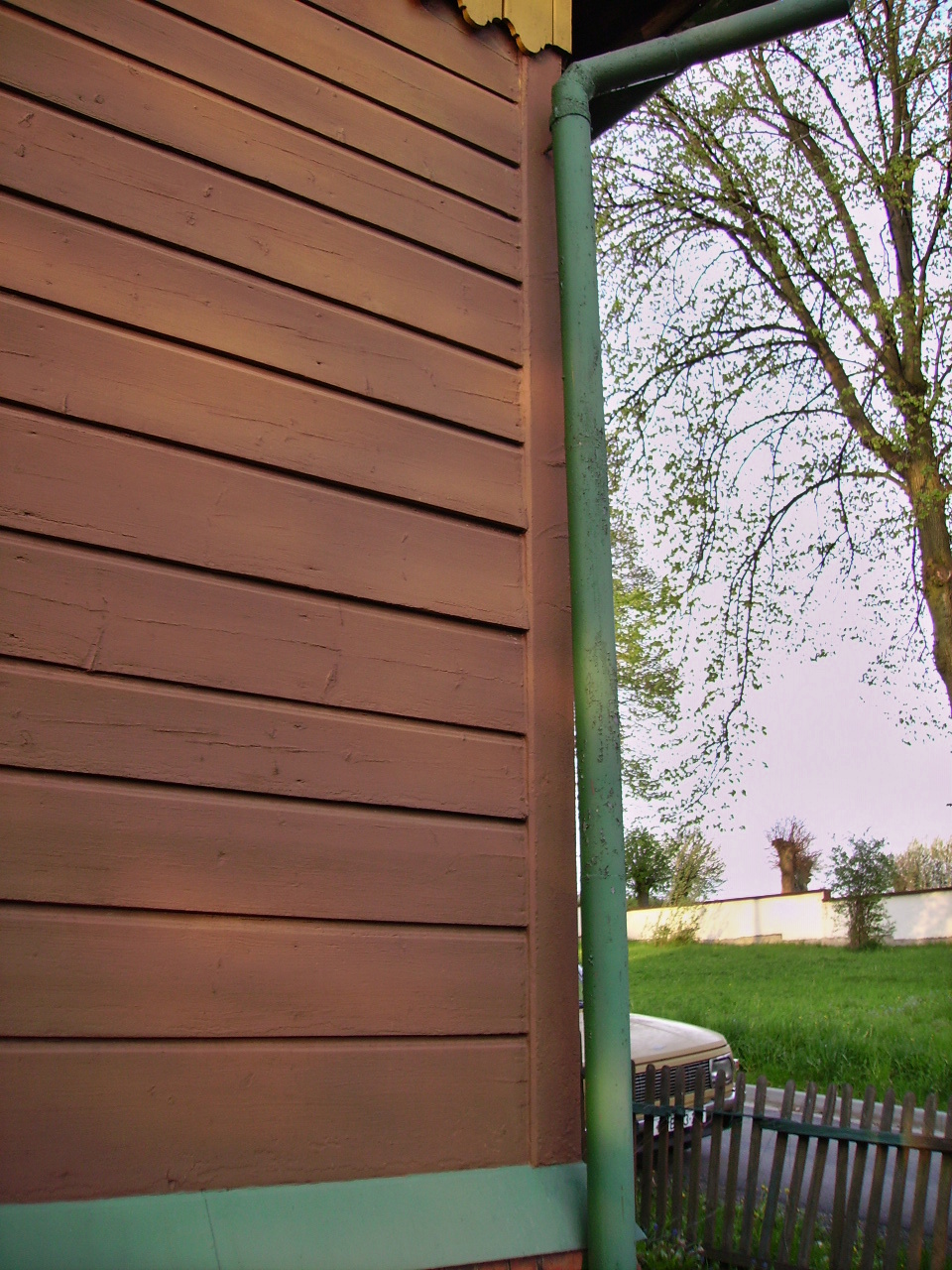 Renovace nátěru dřevěného domu